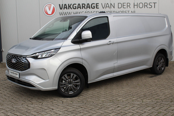 Ford E-Transit Custom 340 L2H1 Limited 71 kWh. Vol elektrisch ! De nieuwe E-Transit Custom is klaar voor de toekomst ! Airco, navigatie, telefoonvoorb., 17" LM wln (meerprijs), 3-zits, camera, parkeersensoren, LED verl., stoel-, stuur-, spiegel- en voorraamverwarming etc.