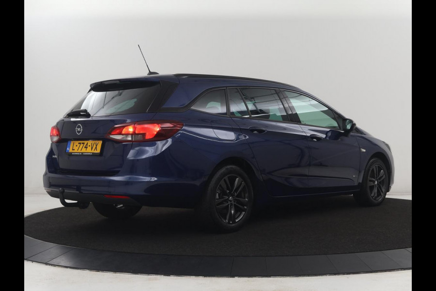 Opel Astra Sports Tourer 1.2 Design & Tech | Cruise control | Camera | Park assist | Trekhaak | Dodehoek detectie | Navigatie | Carplay | Climate control | 16" velgen