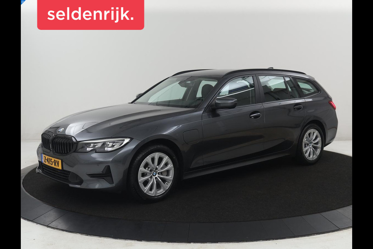 BMW 3 Serie Touring 330e High Executive | SOH 91,4% | Cruise control | Head-up | Stoelverwarming | Trekhaak | Climate control | Park assist | Carplay | Full LED | Elektrische achterklep
