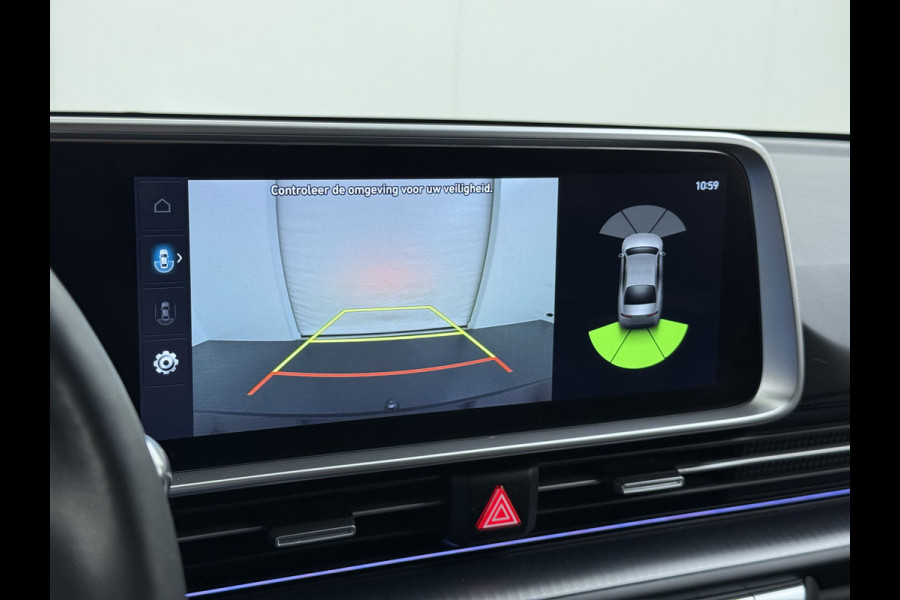 Hyundai IONIQ 6 77.4kWh 229PK Trekhaak SOH 100% Warmtepomp Adap.Cruise Head-Up Stoel+Achterbank+Stuur Verwarming Camera Navi Pdc Apple Carplay A Elek. Achterklep Privacy Glas Lmv Led Lane Assist 1.500KG Trekgewicht 1e Eigenaar Origineel Nederlandse Auto