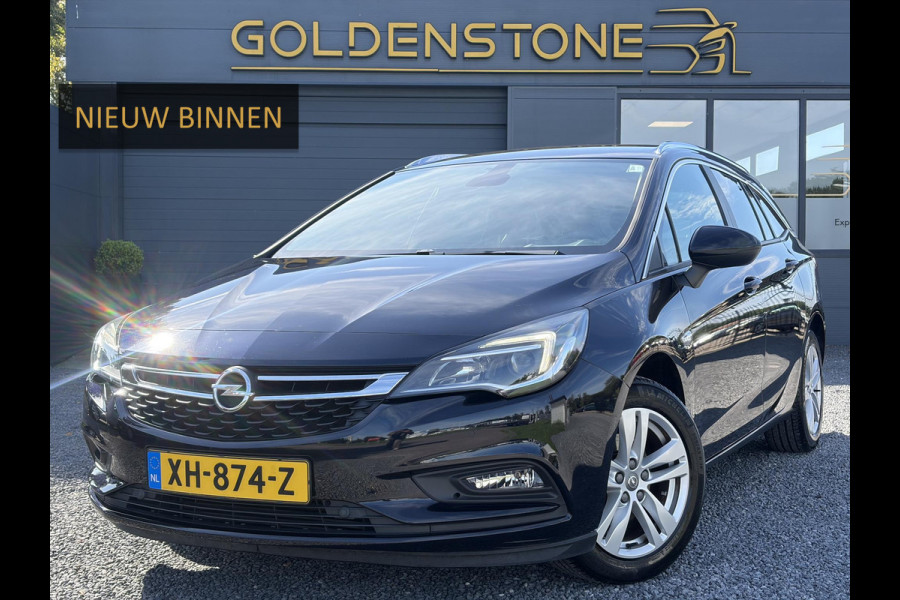 Opel Astra Sports Tourer 1.4 Turbo Online Edition ✓150pk✓2e Eigenaar✓Camera✓Carplay✓Navi✓Pdc V+A✓Stoelverw✓Stuurverw✓Clima✓Cruise✓Lm velgen✓6 Bak✓Comfortstoelen✓Dealer Onderhouden✓N.A.P✓Bj 12-2018✓Apk tot 01-2027