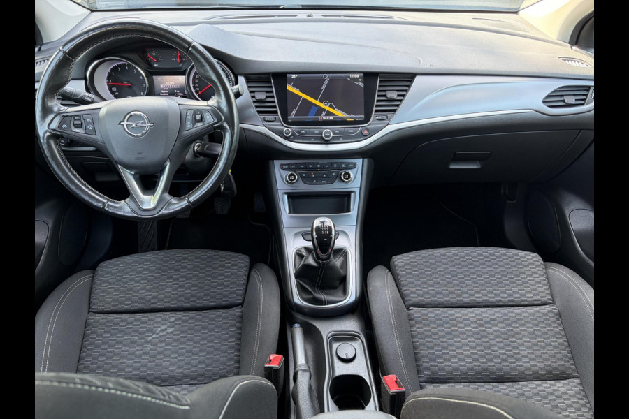 Opel Astra Sports Tourer 1.4 Turbo Online Edition ✓150pk✓2e Eigenaar✓Camera✓Carplay✓Navi✓Pdc V+A✓Stoelverw✓Stuurverw✓Clima✓Cruise✓Lm velgen✓6 Bak✓Comfortstoelen✓Dealer Onderhouden✓N.A.P✓Bj 12-2018✓Apk tot 01-2027