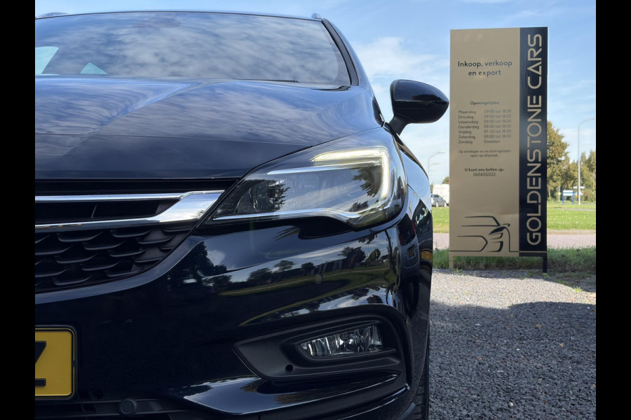 Opel Astra Sports Tourer 1.4 Turbo Online Edition ✓150pk✓2e Eigenaar✓Camera✓Carplay✓Navi✓Pdc V+A✓Stoelverw✓Stuurverw✓Clima✓Cruise✓Lm velgen✓6 Bak✓Comfortstoelen✓Dealer Onderhouden✓N.A.P✓Bj 12-2018✓Apk tot 01-2027