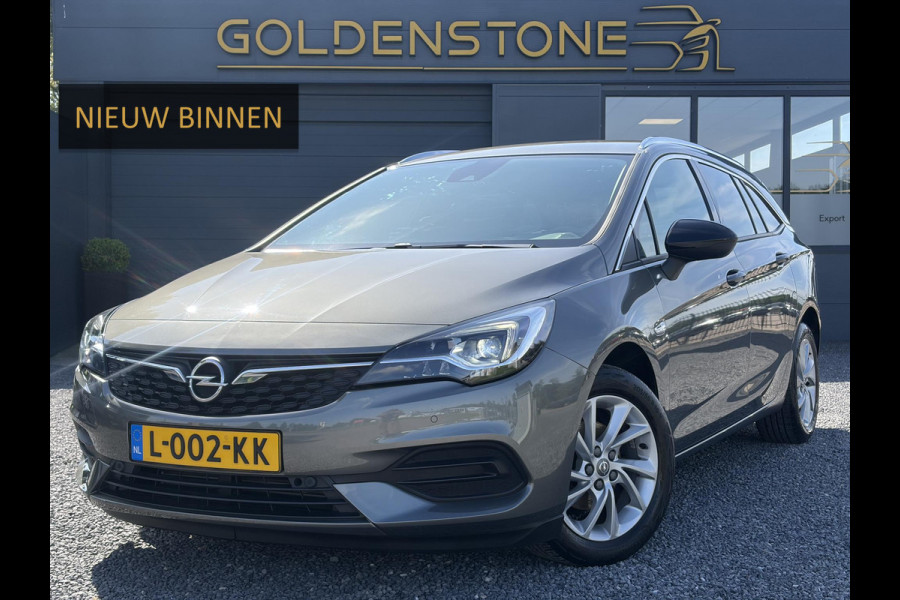 Opel Astra Sports Tourer 1.2 Business Elegance ✓1e Eigenaar✓110pk✓Carplay✓Camera✓Navi✓Clima✓Cruise✓Halfleder✓Comfortstoel✓Pdc V+A✓6 Bak✓Dealer Onderhouden✓Keyless✓Lm velgen✓N.A.P✓Apk tot 06-2027