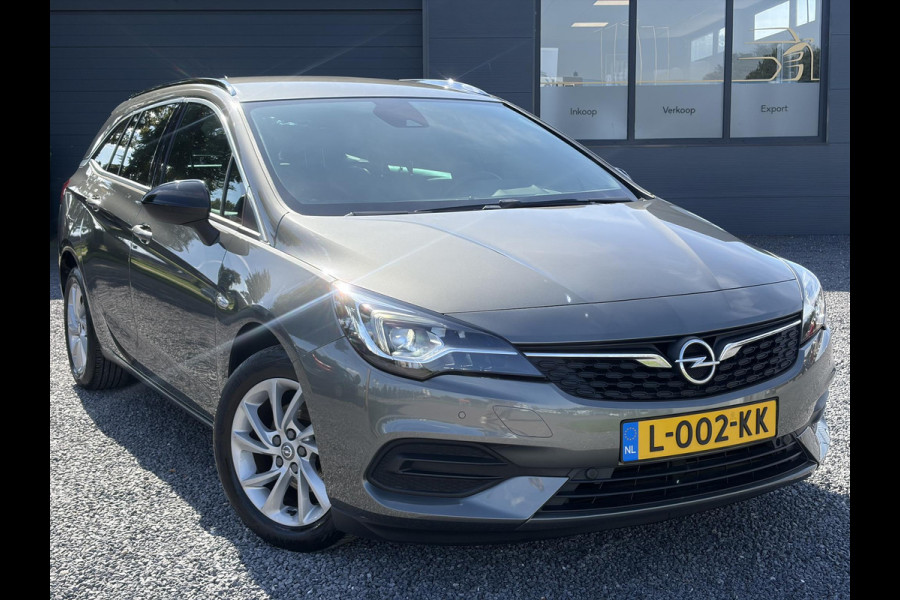 Opel Astra Sports Tourer 1.2 Business Elegance ✓1e Eigenaar✓110pk✓Carplay✓Camera✓Navi✓Clima✓Cruise✓Halfleder✓Comfortstoel✓Pdc V+A✓6 Bak✓Dealer Onderhouden✓Keyless✓Lm velgen✓N.A.P✓Apk tot 06-2027