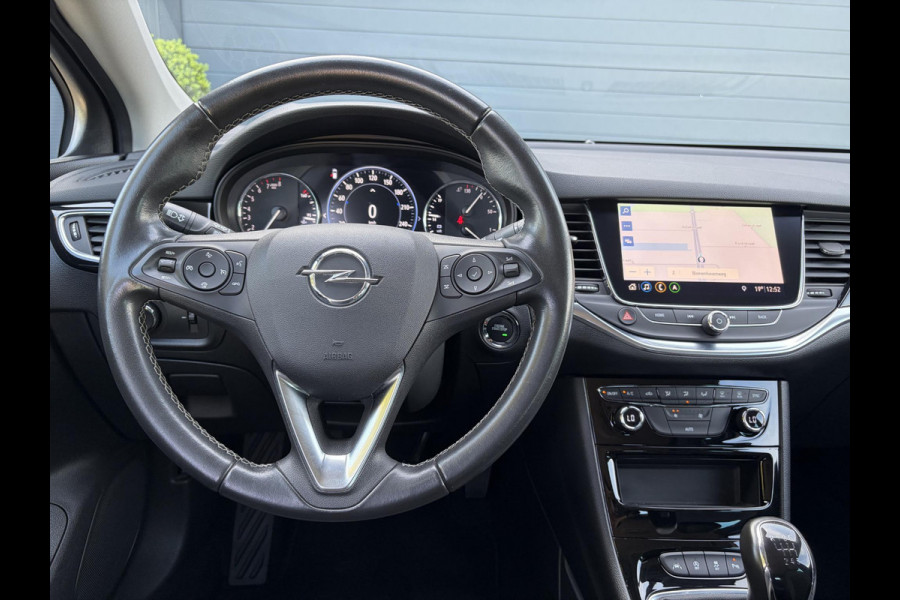 Opel Astra Sports Tourer 1.2 Business Elegance ✓1e Eigenaar✓110pk✓Carplay✓Camera✓Navi✓Clima✓Cruise✓Halfleder✓Comfortstoel✓Pdc V+A✓6 Bak✓Dealer Onderhouden✓Keyless✓Lm velgen✓N.A.P✓Apk tot 06-2027