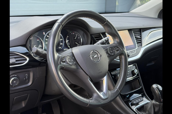 Opel Astra Sports Tourer 1.2 Business Elegance ✓1e Eigenaar✓110pk✓Carplay✓Camera✓Navi✓Clima✓Cruise✓Halfleder✓Comfortstoel✓Pdc V+A✓6 Bak✓Dealer Onderhouden✓Keyless✓Lm velgen✓N.A.P✓Apk tot 06-2027