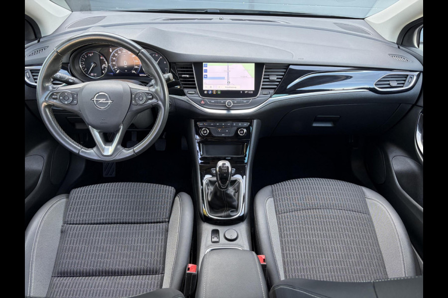 Opel Astra Sports Tourer 1.2 Business Elegance ✓1e Eigenaar✓110pk✓Carplay✓Camera✓Navi✓Clima✓Cruise✓Halfleder✓Comfortstoel✓Pdc V+A✓6 Bak✓Dealer Onderhouden✓Keyless✓Lm velgen✓N.A.P✓Apk tot 06-2027