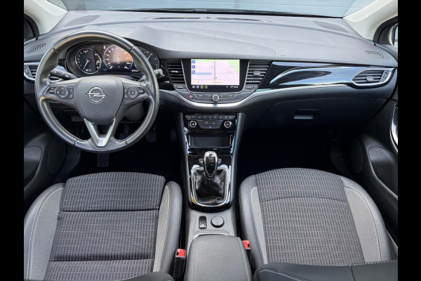 Opel Astra Sports Tourer 1.2 Business Elegance ✓1e Eigenaar✓110pk✓Carplay✓Camera✓Navi✓Clima✓Cruise✓Halfleder✓Comfortstoel✓Pdc V+A✓6 Bak✓Dealer Onderhouden✓Keyless✓Lm velgen✓N.A.P✓Apk tot 06-2027