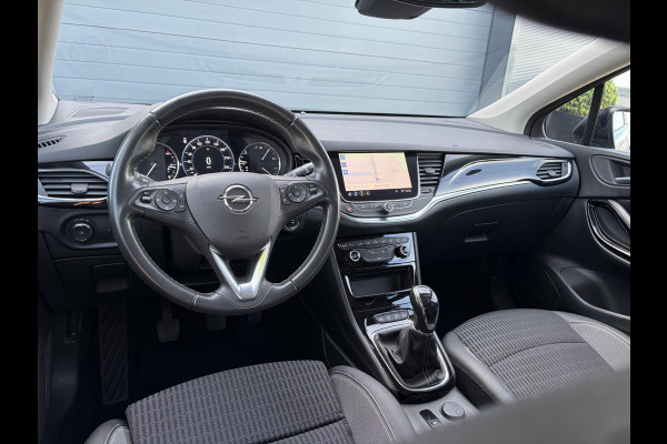Opel Astra Sports Tourer 1.2 Business Elegance ✓1e Eigenaar✓110pk✓Carplay✓Camera✓Navi✓Clima✓Cruise✓Halfleder✓Comfortstoel✓Pdc V+A✓6 Bak✓Dealer Onderhouden✓Keyless✓Lm velgen✓N.A.P✓Apk tot 06-2027