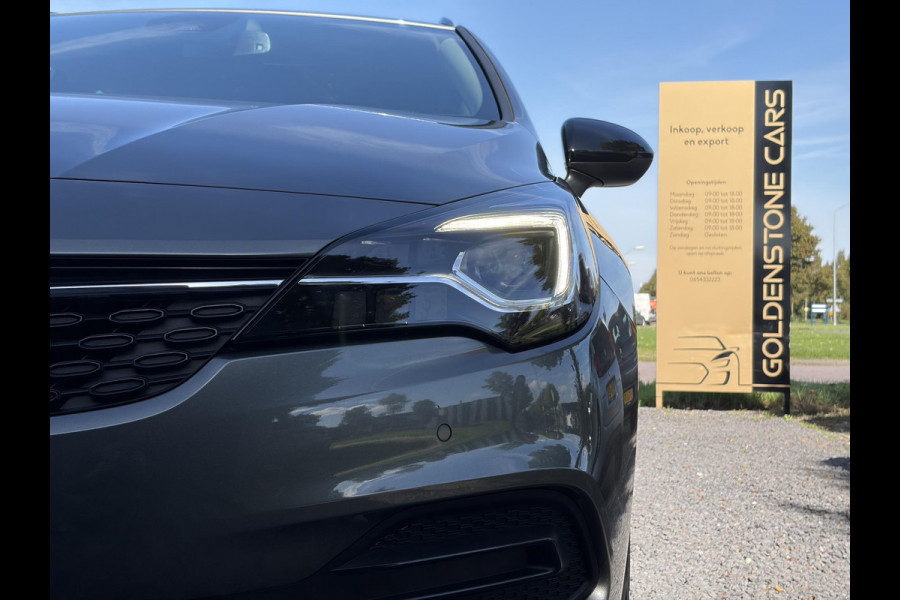 Opel Astra Sports Tourer 1.2 Business Elegance ✓1e Eigenaar✓110pk✓Carplay✓Camera✓Navi✓Clima✓Cruise✓Halfleder✓Comfortstoel✓Pdc V+A✓6 Bak✓Dealer Onderhouden✓Keyless✓Lm velgen✓N.A.P✓Apk tot 06-2027