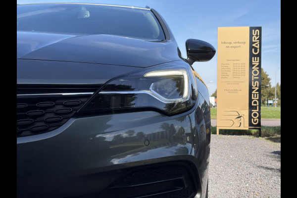 Opel Astra Sports Tourer 1.2 Business Elegance ✓1e Eigenaar✓110pk✓Carplay✓Camera✓Navi✓Clima✓Cruise✓Halfleder✓Comfortstoel✓Pdc V+A✓6 Bak✓Dealer Onderhouden✓Keyless✓Lm velgen✓N.A.P✓Apk tot 06-2027