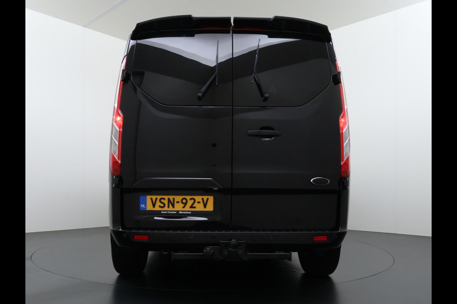 Ford Transit Custom 320 2.0TDCI 170PK Automaat L2H1 Dubbele Cabine 2X Schuifdeur Adap.Cruise 5-Persoons Leder+Verwarmd Trekhaak Navi Camera Pdc Appl Euro 6 Lmv 18" Sidebars Betonplex Vloer Wandbetimmering Lane Assist 3.200KG Trekgewicht