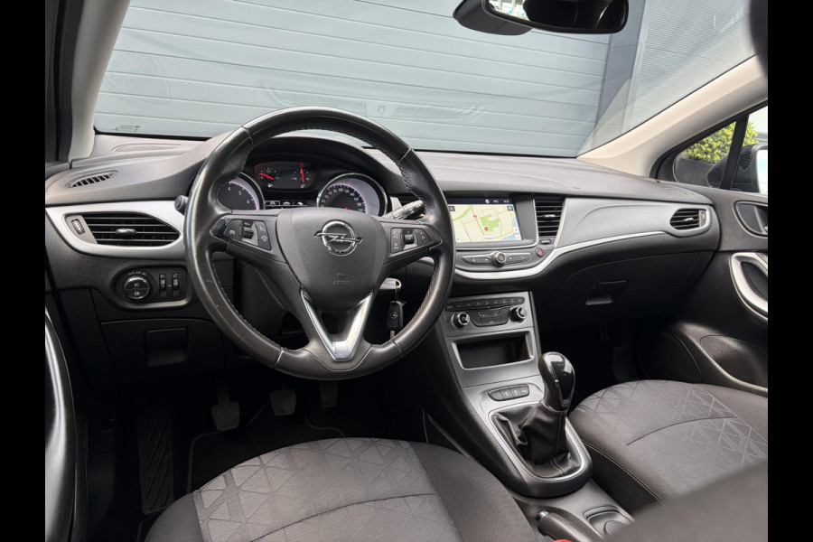 Opel Astra Sports Tourer 1.4 Turbo 120 Jaar Edition ✓150pk✓Carplay✓Navi✓Trekhaak✓Pdc V+A✓Clima✓Cruise✓6 Bak✓Lm velgen✓N.A.P✓Apk tot 02-2028
