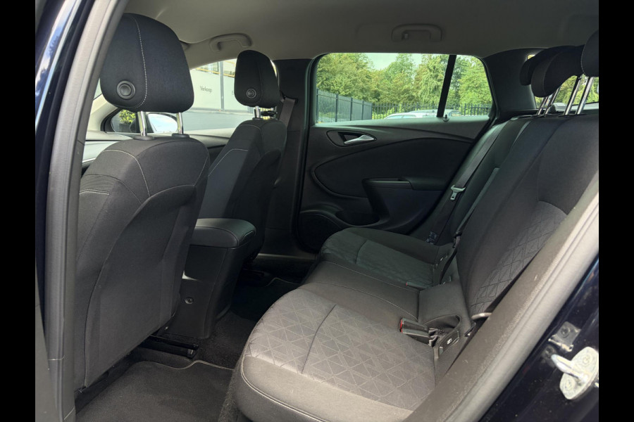 Opel Astra Sports Tourer 1.4 Turbo 120 Jaar Edition ✓150pk✓Carplay✓Navi✓Trekhaak✓Pdc V+A✓Clima✓Cruise✓6 Bak✓Lm velgen✓N.A.P✓Apk tot 02-2028