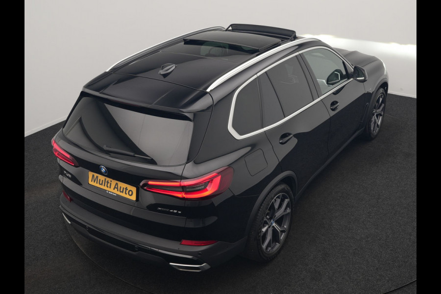 BMW X5 xDrive45e High Executive PHEV 395pk Dealer O.H. | Active Steering | Trekhaak Af Fabriek | Panodak | Luchtvering | Head Up | Adaptive Cruise | 360 Camera | Laser LED | Nappa Lederen Comfortstoelen Memory & Verwarmd | Adaptief Onderstel | Keyless | Sfeerverlichting | Apple Carplay | 21"L.M | Plug In Hybrid |