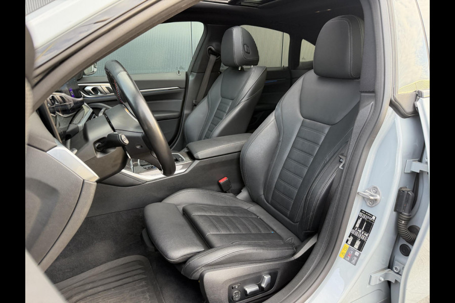 BMW i4 M50 High Executive 84 kWh 19"/SOH 99%/Schuif-kanteldak/Trekhaak/Leder + memory/Stoel + stuurverwarming/Harman Kardon/Dodehoek/Adaptieve cruise/Keyless/360 camera