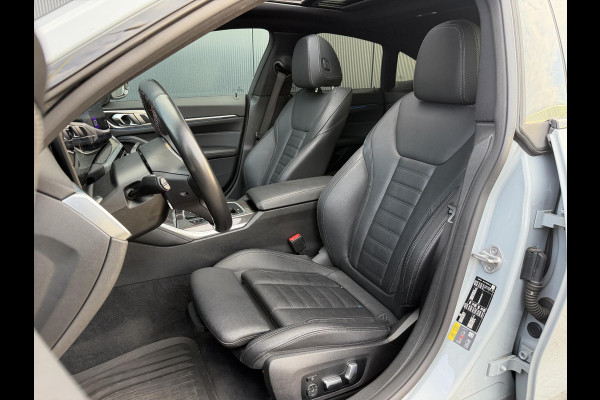 BMW i4 M50 High Executive 84 kWh 19"/SOH 99%/Schuif-kanteldak/Trekhaak/Leder + memory/Stoel + stuurverwarming/Harman Kardon/Dodehoek/Adaptieve cruise/Keyless/360 camera