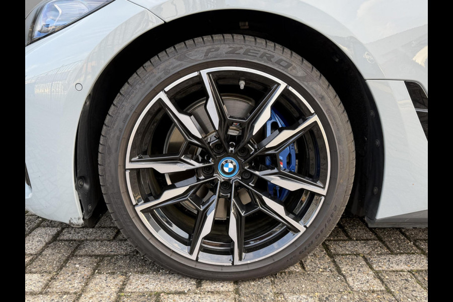 BMW i4 M50 High Executive 84 kWh 19"/SOH 99%/Schuif-kanteldak/Trekhaak/Leder + memory/Stoel + stuurverwarming/Harman Kardon/Dodehoek/Adaptieve cruise/Keyless/360 camera