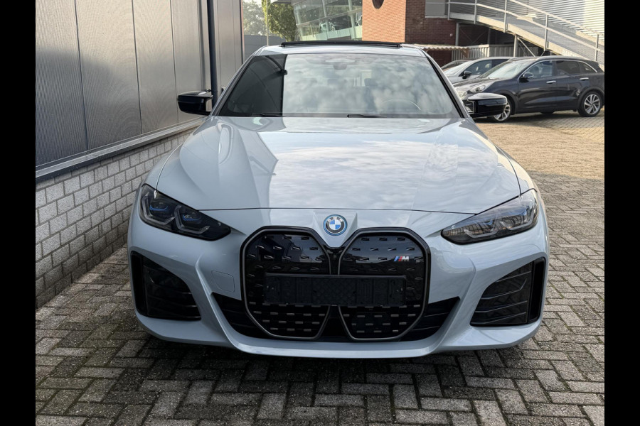 BMW i4 M50 High Executive 84 kWh 19"/SOH 99%/Schuif-kanteldak/Trekhaak/Leder + memory/Stoel + stuurverwarming/Harman Kardon/Dodehoek/Adaptieve cruise/Keyless/360 camera