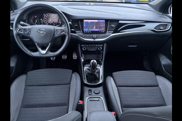 Opel Astra Sports Tourer 1.2 Elegance ✓110pk✓Camera✓Carplay✓Navi✓Halfleder✓Keyless✓Trekhaak✓Pdc V+A✓Clima✓Cruise✓Elekt Stoel✓Recent beurt gehad✓Dodehoeksensor✓Rijstrooksensor✓Lm velgen✓N.A.P✓Apk tot 11-2027