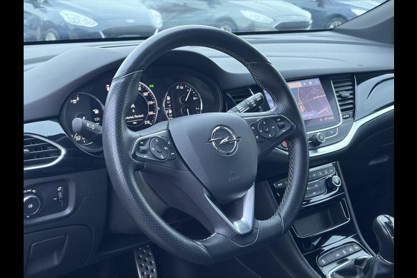 Opel Astra Sports Tourer 1.2 Elegance ✓110pk✓Camera✓Carplay✓Navi✓Halfleder✓Keyless✓Trekhaak✓Pdc V+A✓Clima✓Cruise✓Elekt Stoel✓Recent beurt gehad✓Dodehoeksensor✓Rijstrooksensor✓Lm velgen✓N.A.P✓Apk tot 11-2027
