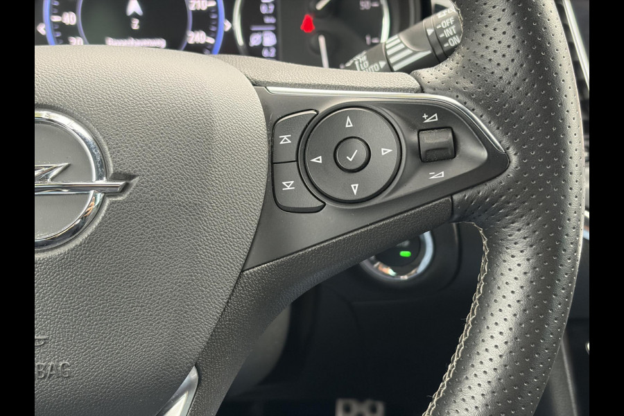 Opel Astra Sports Tourer 1.2 Elegance ✓110pk✓Camera✓Carplay✓Navi✓Halfleder✓Keyless✓Trekhaak✓Pdc V+A✓Clima✓Cruise✓Elekt Stoel✓Recent beurt gehad✓Dodehoeksensor✓Rijstrooksensor✓Lm velgen✓N.A.P✓Apk tot 11-2027