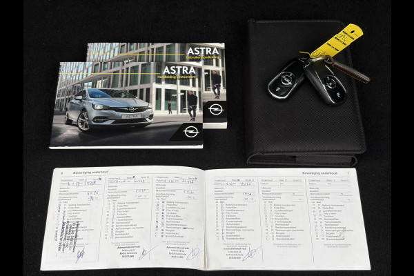 Opel Astra Sports Tourer 1.2 Elegance ✓110pk✓Camera✓Carplay✓Navi✓Halfleder✓Keyless✓Trekhaak✓Pdc V+A✓Clima✓Cruise✓Elekt Stoel✓Recent beurt gehad✓Dodehoeksensor✓Rijstrooksensor✓Lm velgen✓N.A.P✓Apk tot 11-2027