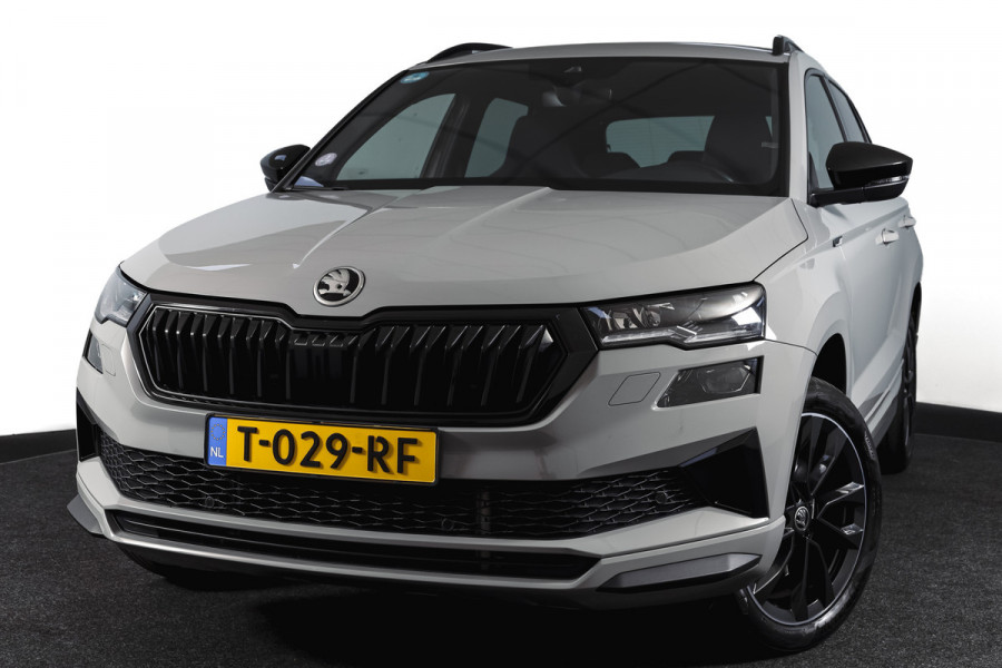 Škoda Karoq 1.5 TSI ACT 150 PK Sportline Business | Afn. Trekhaak | Dig. Cockpit | Adapt. Cruise | Stoel-+Stuurverw. | Matrix LED | Camera | NAV+App. Connect | ECC | Elek. Klep | LM 18" |