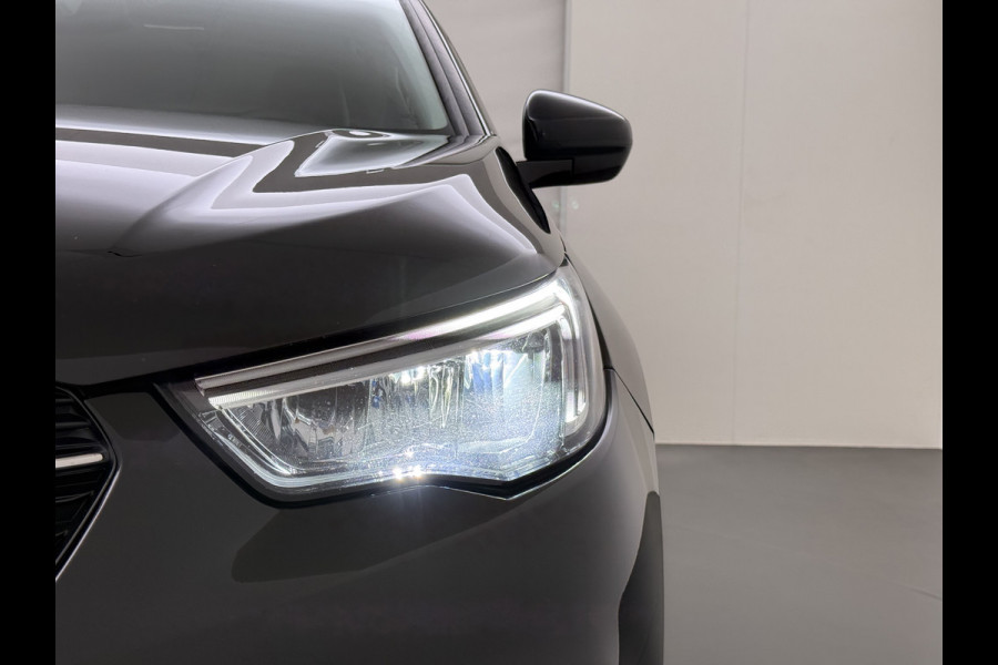 Opel Grandland X 1.2T 131pk Camera Apple/Android Elek.klep Bordherk. Blindspot 1/2Leer Navi Lane-dep. Keyless Aut.Verlichting Led Usb Tel. Ecc CruiseControl Innovation Regensensor Pdc Mistlampen Elek.Inkl.Spiegels 18''LM 1.2Turbo