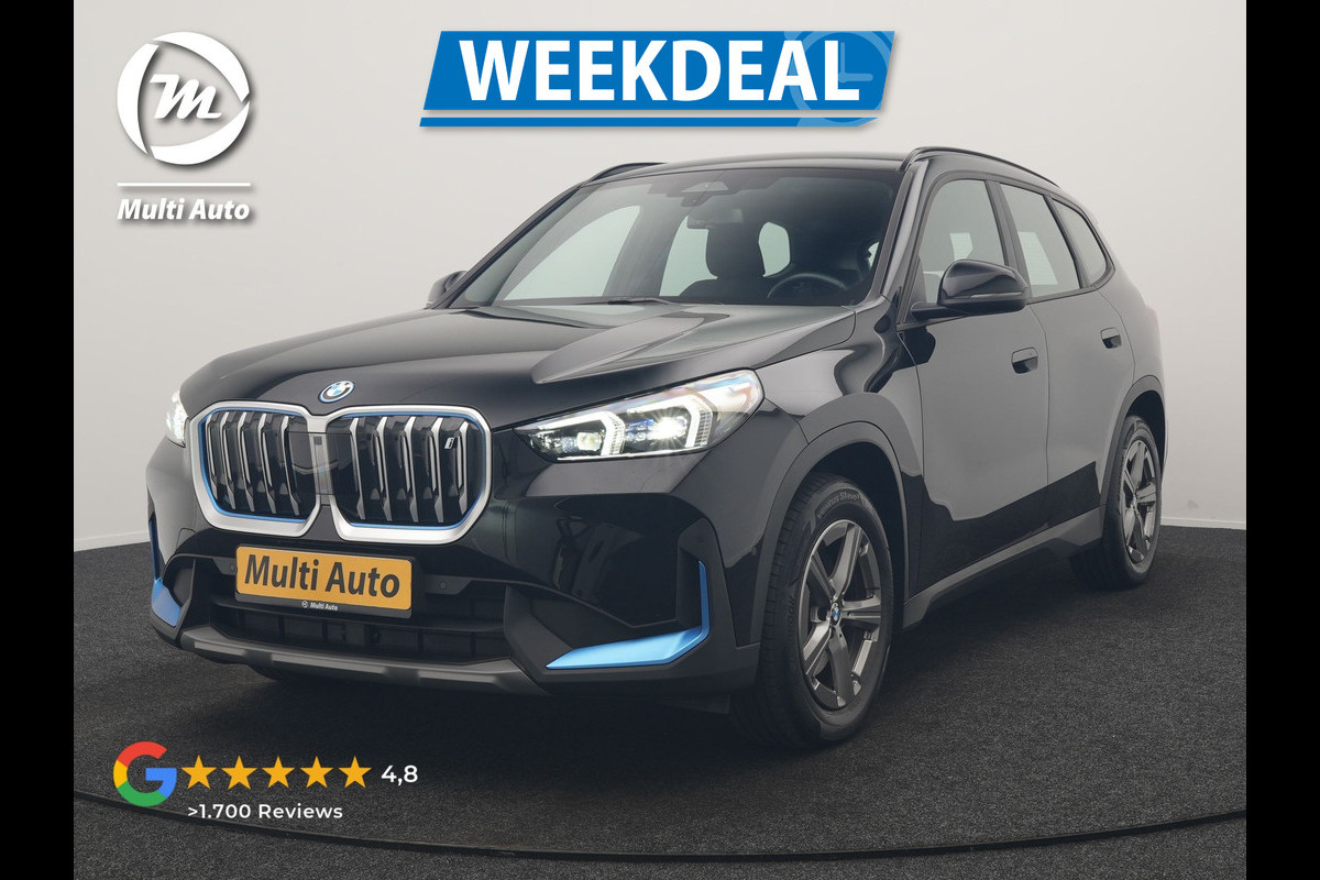 BMW iX1 xDrive30 67 kWh 313pk Dealer O.H. | Trekhaak Af Fabriek | Camera | Adaptief M Onderstel | Voorstoelen Verwarmd | Blis | Keyless | Apple Carplay | Adaptive LED | Sfeerverlichting | Widescreen Navi | DAB |