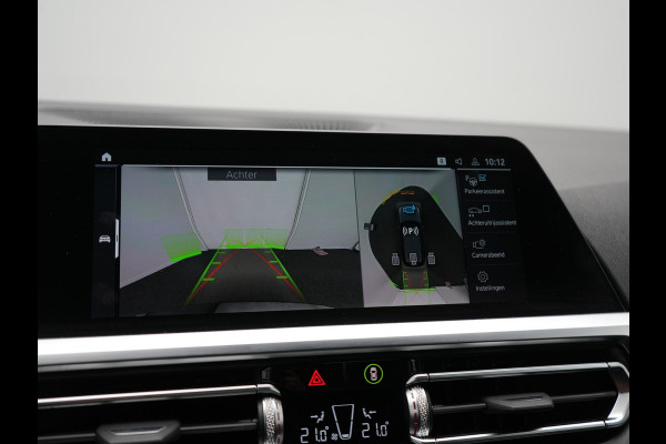 BMW 3 Serie Touring 330e xDrive Sportline PHEV 293pk Dealer O.H | SOH 87,9% | Trekhaak Af Fabriek | Camera | Lederen Sportstoelen Verwarmd | Apple Carplay | Sfeerverlichting | Navigatie | Virtual | Cruise Control | DAB | 18"L.M | Plug In Hybrid |