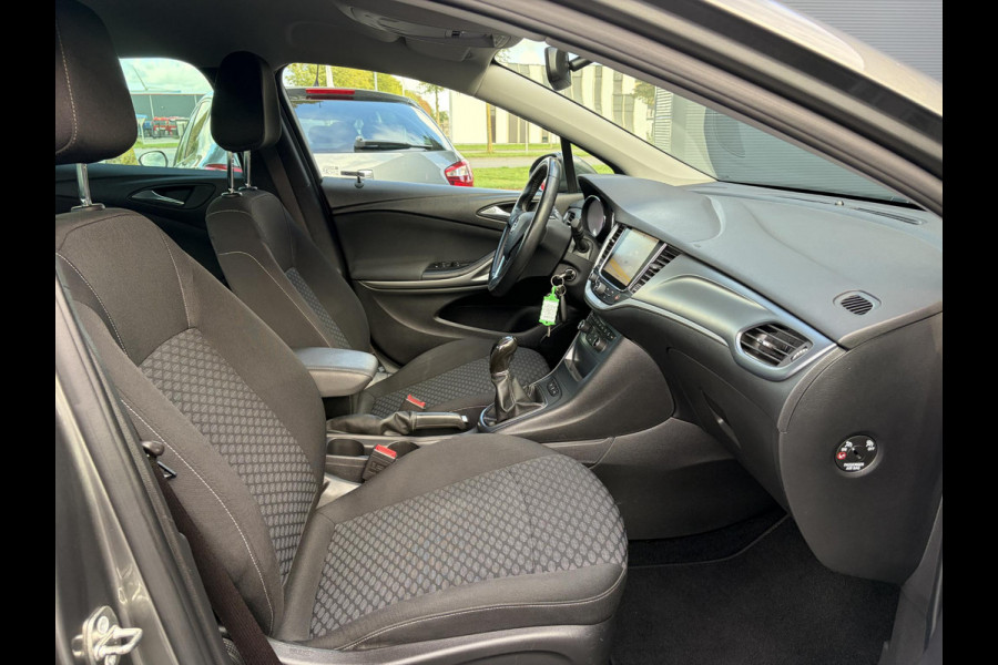 Opel Astra 1.0 Online Edition ✓2e Eigenaar✓Trekhaak✓Carplay✓Dealer Onderhouden✓Navi✓105pk✓Pdc V+A✓Clima✓Cruise✓Lm velgen✓N.A.P✓Apk tot 05-2027