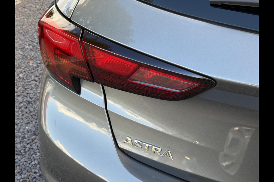 Opel Astra 1.0 Online Edition ✓2e Eigenaar✓Trekhaak✓Carplay✓Dealer Onderhouden✓Navi✓105pk✓Pdc V+A✓Clima✓Cruise✓Lm velgen✓N.A.P✓Apk tot 05-2027