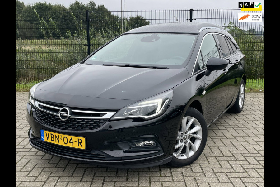 Opel Astra SPORTS TOURER+ | Grijs Kenteken | Carplay | PDC | Trekhaak | 1ste eigenaar |