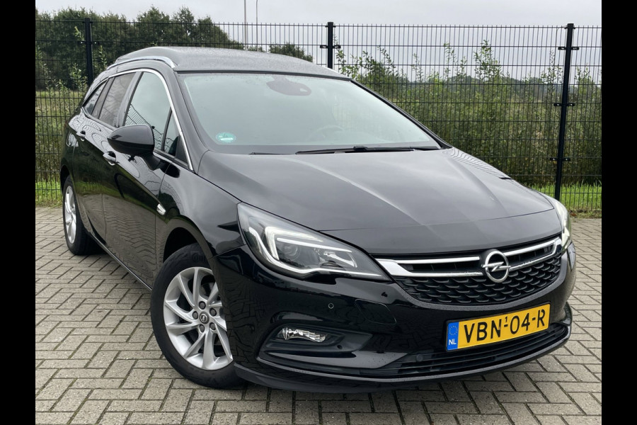 Opel Astra SPORTS TOURER+ | Grijs Kenteken | Carplay | PDC | Trekhaak | 1ste eigenaar |