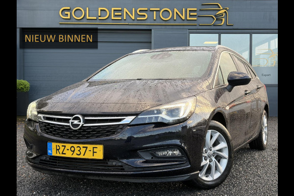 Opel Astra Sports Tourer 1.4 Innovation ✓Trekhaak✓Camera✓Carplay✓Navi✓Recent beurt gehad✓150pk✓Keyless✓Halfleder✓6 Bak✓Rijstrooksensor✓Dodehoeksensor✓Pdc V+A✓Lm velgen✓Clima✓Cruise✓N.A.P✓Apk tot 09-2027