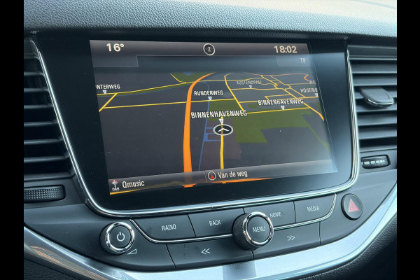 Opel Astra Sports Tourer 1.4 Innovation ✓Trekhaak✓Camera✓Carplay✓Navi✓Recent beurt gehad✓150pk✓Keyless✓Halfleder✓6 Bak✓Rijstrooksensor✓Dodehoeksensor✓Pdc V+A✓Lm velgen✓Clima✓Cruise✓N.A.P✓Apk tot 09-2027