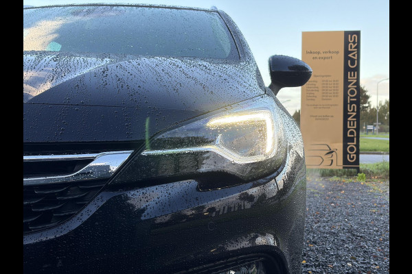 Opel Astra Sports Tourer 1.4 Innovation ✓Trekhaak✓Camera✓Carplay✓Navi✓Recent beurt gehad✓150pk✓Keyless✓Halfleder✓6 Bak✓Rijstrooksensor✓Dodehoeksensor✓Pdc V+A✓Lm velgen✓Clima✓Cruise✓N.A.P✓Apk tot 09-2027