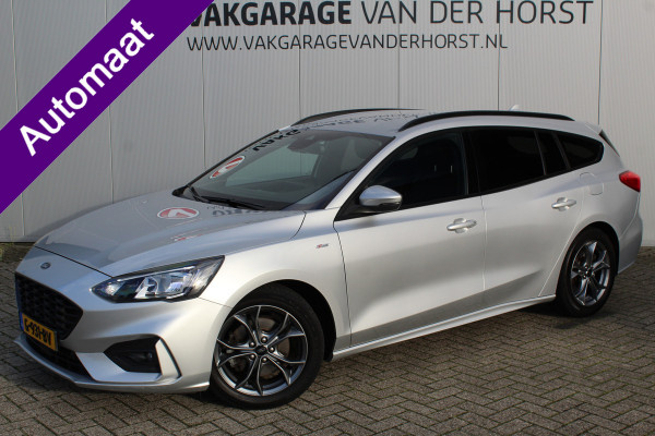 Ford FOCUS Wagon 1.0-125pk EcoBoost ST-Line AUTOMAAT ! Fijne, ruime en erg goed onderhouden wagen ! Autm. airco dual, cruise cntrl, pdc v+a, metallic lak, navigatie, camera, bluetooth tel. voorb., LM wielen, keyless, stoel-, stuur- en voorraamverw., etc.