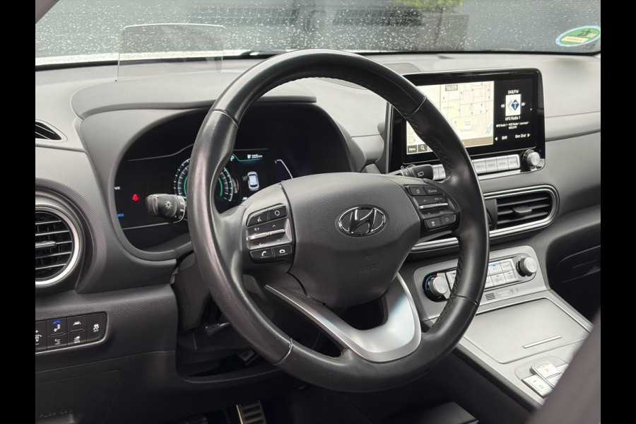 Hyundai Kona EV Fashion 64 kWh ✓2e Eigenaar✓Carplay✓Camera✓Trekhaak✓Dealer Onderhouden✓Draadloze telefoonlader✓Navi✓Keyless✓✓Rijstrooksensor✓Dodehoeksensor✓Pdc✓Lm velgen 17"✓Clima✓Cruise✓204pk✓N.A.P✓Bj 12-2020✓Apk tot 09-2028