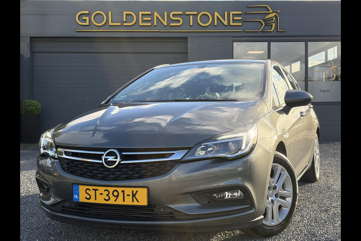 Opel Astra 1.0 Online Edition ✓2e Eigenaar✓Trekhaak✓Carplay✓Dealer Onderhouden✓Navi✓105pk✓Pdc V+A✓Clima✓Cruise✓Lm velgen✓N.A.P✓Apk tot 05-2027