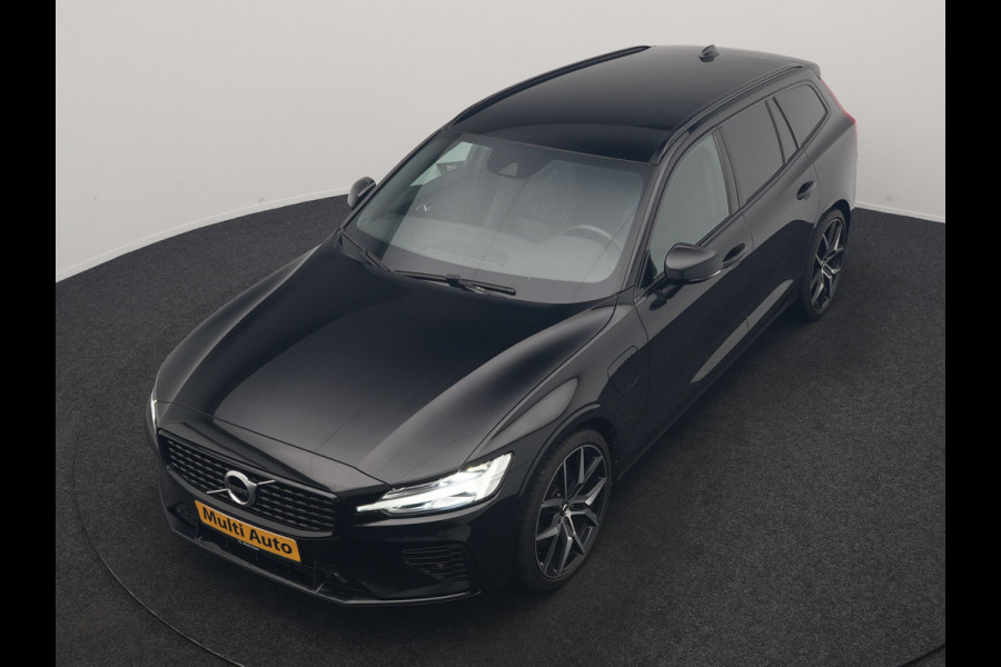Volvo V60 T6 Recharge AWD R-Design PHEV 340pk Dealer O.H. | SOH 82,8% | Camera | Harman / Kardon | Lederen Sportstoelen Memory & Verwarmd | Stuur Verwarmd | Keyless | BLIS | Cruise Control | Apple Carplay | Navigatie | DAB | 20"L.M | Plug In Hybrid