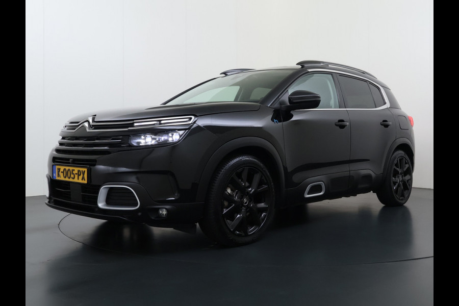 Citroën C5 Aircross 1.6T PHEV Hybrid 225PK Automaat Adap.Cruise Leder+Verwarmd Panoramadak Trekhaak Elek.Stoel+Memory Apple Carplay Android Auto Bus Navi Lmv 19" Privacy Glas Led Isofix DAB Draadloos opladen Lane Assist Regen-Lichtsensor 1.300KG Trekgewicht Dealeronderhouden Origineel Nederlandse Auto