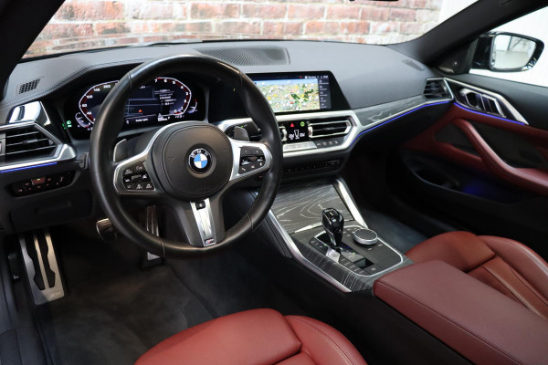 BMW 4 Serie Coupé M440i xDrive High Executive M Sport Pakket / Adaptief M-onderstel / Panoramadak / Laserlicht / Head-Up Display / M Sportrem / Driving Assistant Professional / Harman Kardon / Stoel- en stuurverwarming / Shadow line / 19 Inch / Live Cockpit Professional / Active Guard Plus / Comfort access