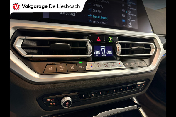 BMW 3 Serie Touring 330e Business Edition Plus / trekhaak / sportstoelen / cruise