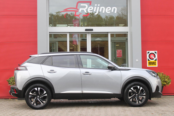 Peugeot 2008 1.2 130PK AUTOMAAT ALLURE PACK | TREKHAAK | ADAPTIVE CRUISE CONTROL | 3-D INSTRUMENTENPANEEL | NAVIGATIE | APPLE CARPLAY/ANDROID AUTO | LED KOPLAMPEN | CLIMATE CONTROL | 17" LICHTMETALEN VELGEN | ACHTERUITRIJ CAMERA | PARKEERSENSOREN | DAB+ RADIO | GETINTE RUITEN |