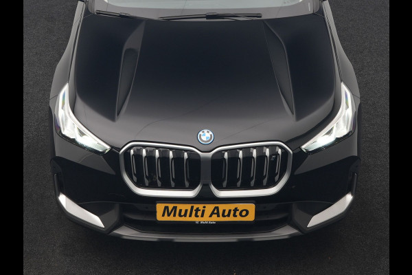BMW iX1 xDrive30 67 kWh 313pk Dealer O.H | SOH 94,7% | Panodak | Camera | Stoelen Massage & Verwarmd | Blis | Apple Carplay | Cruise Control | DAB | Navigatie | Virtual | 18"L.M |
