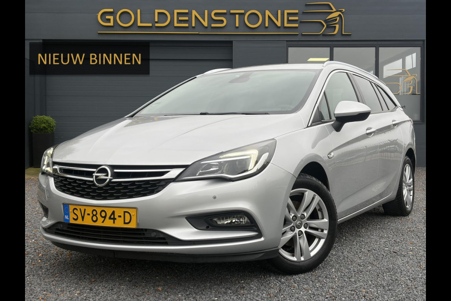 Opel Astra Sports Tourer 1.4 Online Edition ✓2e Eigenaar✓Trekhaak✓Carplay✓Navi✓Recent beurt gehad✓150pk✓Keyless✓6 Bak✓Rijstrooksensor✓Dodehoeksensor✓Pdc V+A✓Lm velgen✓Clima✓Cruise✓N.A.P✓Apk tot 06-2027