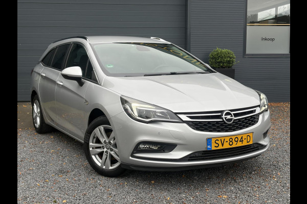 Opel Astra Sports Tourer 1.4 Online Edition ✓2e Eigenaar✓Trekhaak✓Carplay✓Navi✓Recent beurt gehad✓150pk✓Keyless✓6 Bak✓Rijstrooksensor✓Dodehoeksensor✓Pdc V+A✓Lm velgen✓Clima✓Cruise✓N.A.P✓Apk tot 06-2027